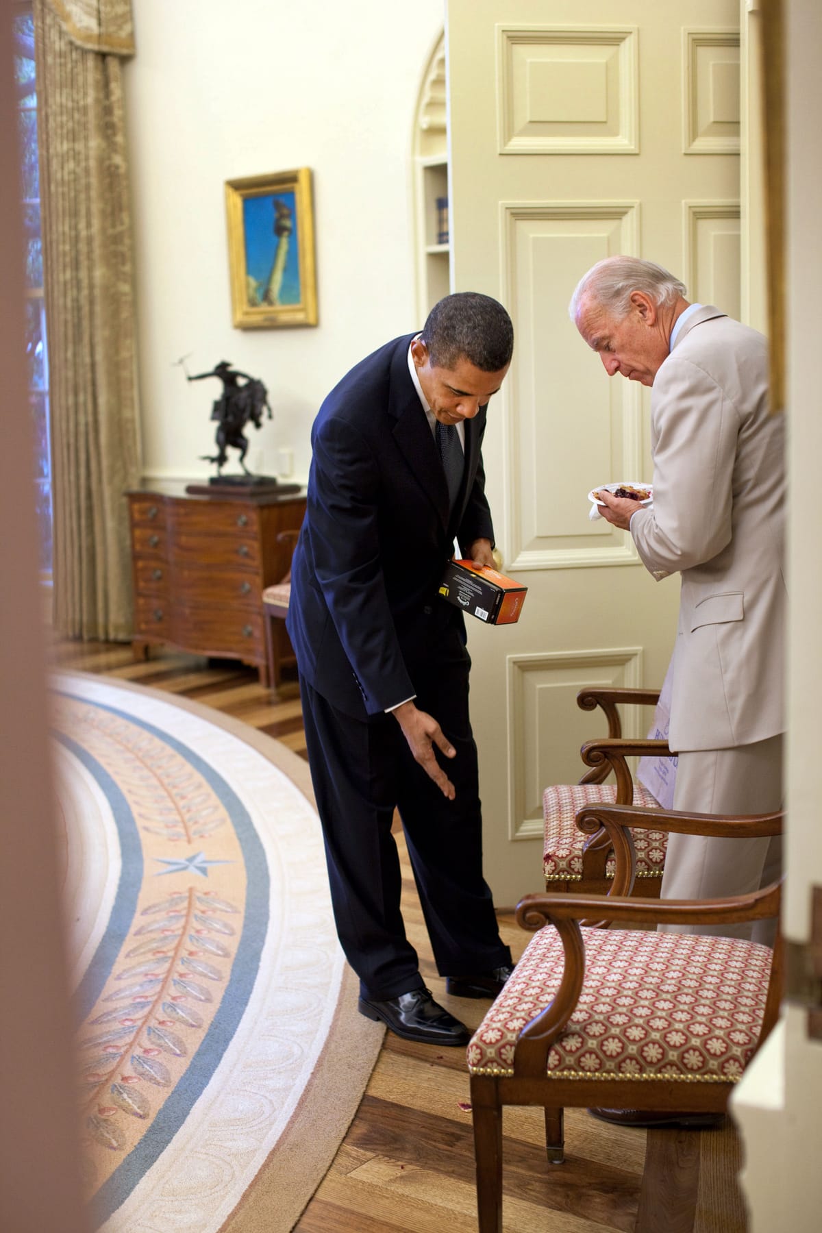 President Obama points out cake crumbs spilled by then-Veep Biden. 