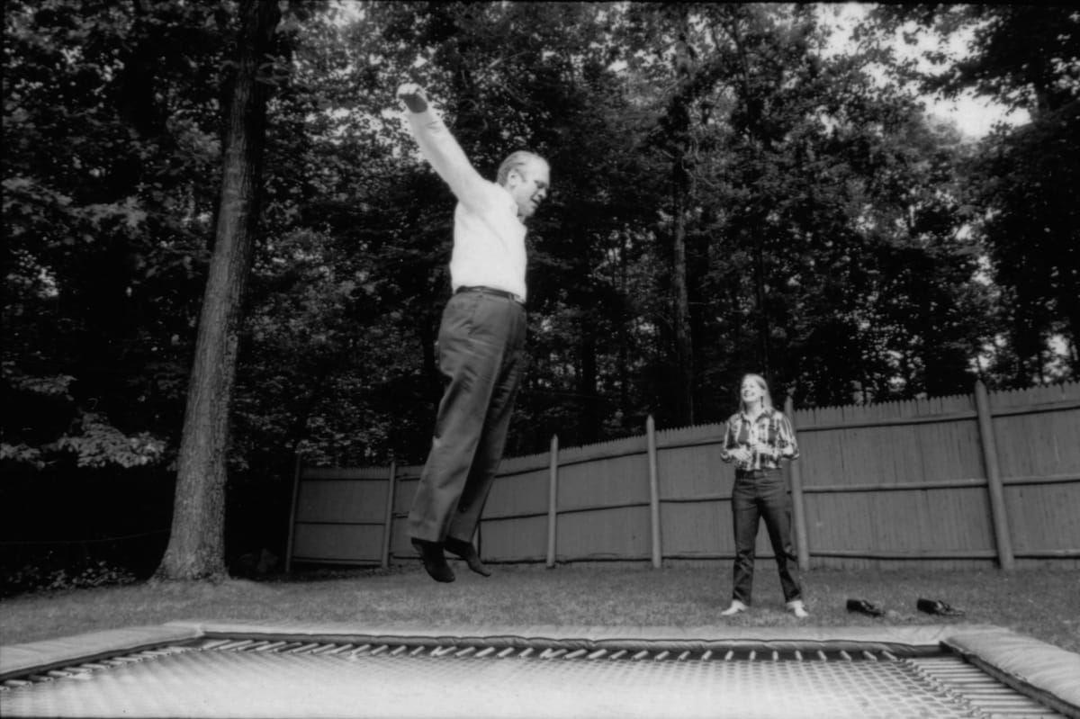 President Ford jumping on a trampoline at Camp David. 