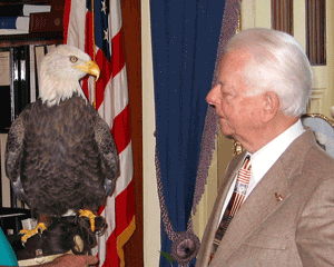 Senator Robert Byrd looks at an eagle. 