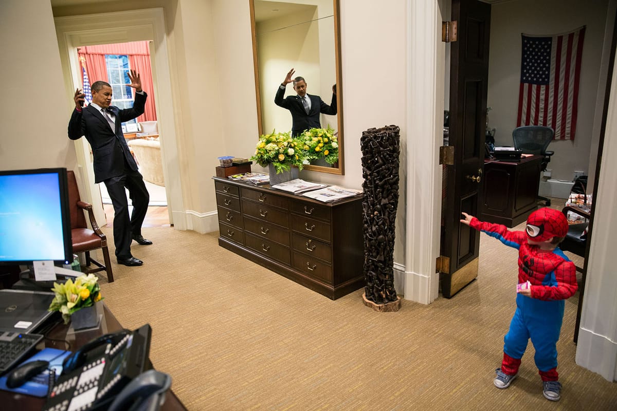 President Obama reacts to a kiddo in a Spiderman costume. 